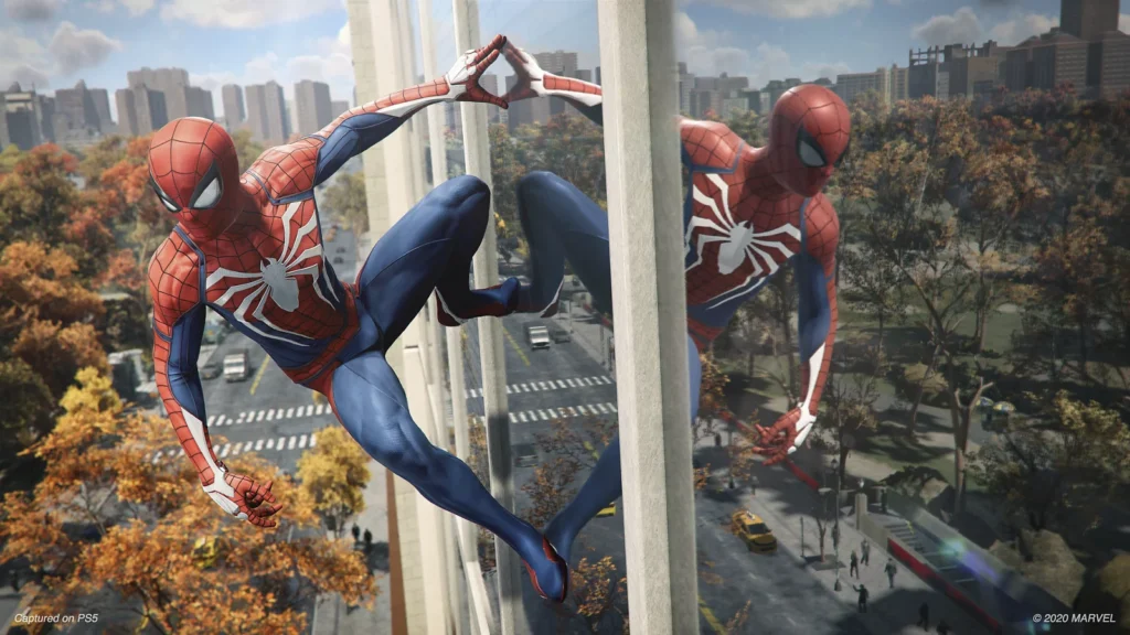Official Marvel’s Spider-Man Remastered image from PlayStation.com showing Spider-Man climbing a glass building with reflection, captured on PS5.